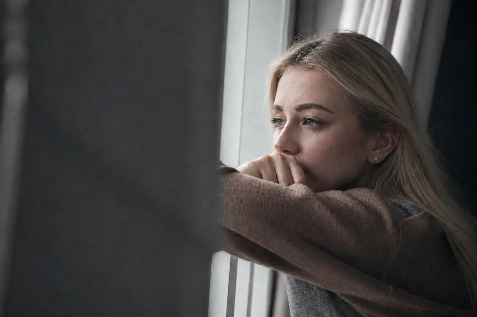 sad-woman-in-window_Hero